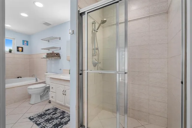 a bathroom with a sink a toilet and bathtub