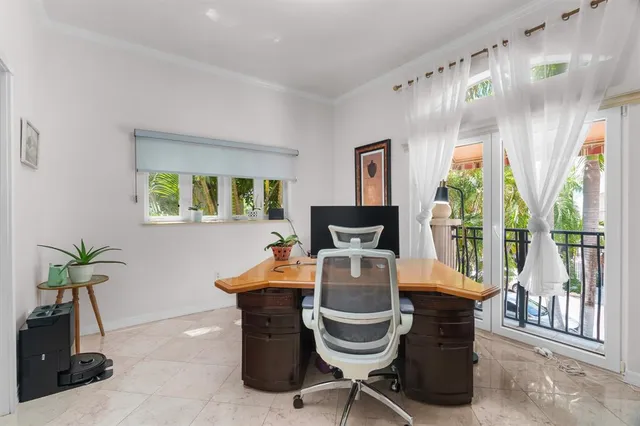 a view of a workspace with a bookshelf
