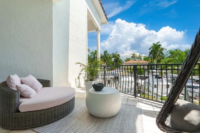 a view of swimming pool with outdoor seating