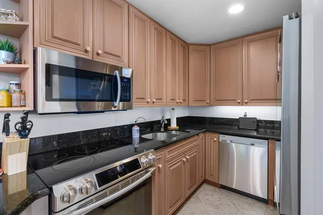 a view of a livingroom with furniture and a flat screen tv