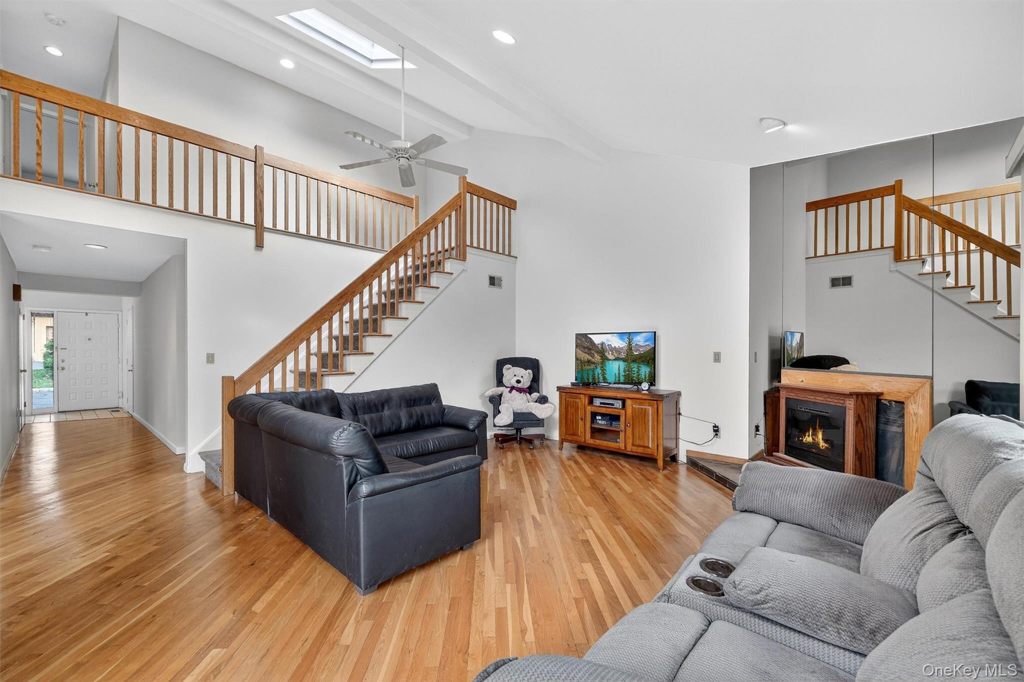 200 California Road, Unit 9 Mount Vernon, NY 10552 - Photo 18 of 50 a living room with furniture or fireplace and a wooden floor