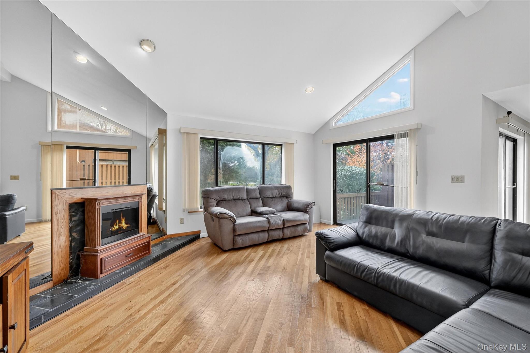 200 California Road, Unit 9 Mount Vernon, NY 10552 - Photo 20 of 50 a living room with fireplace furniture and a wooden floor