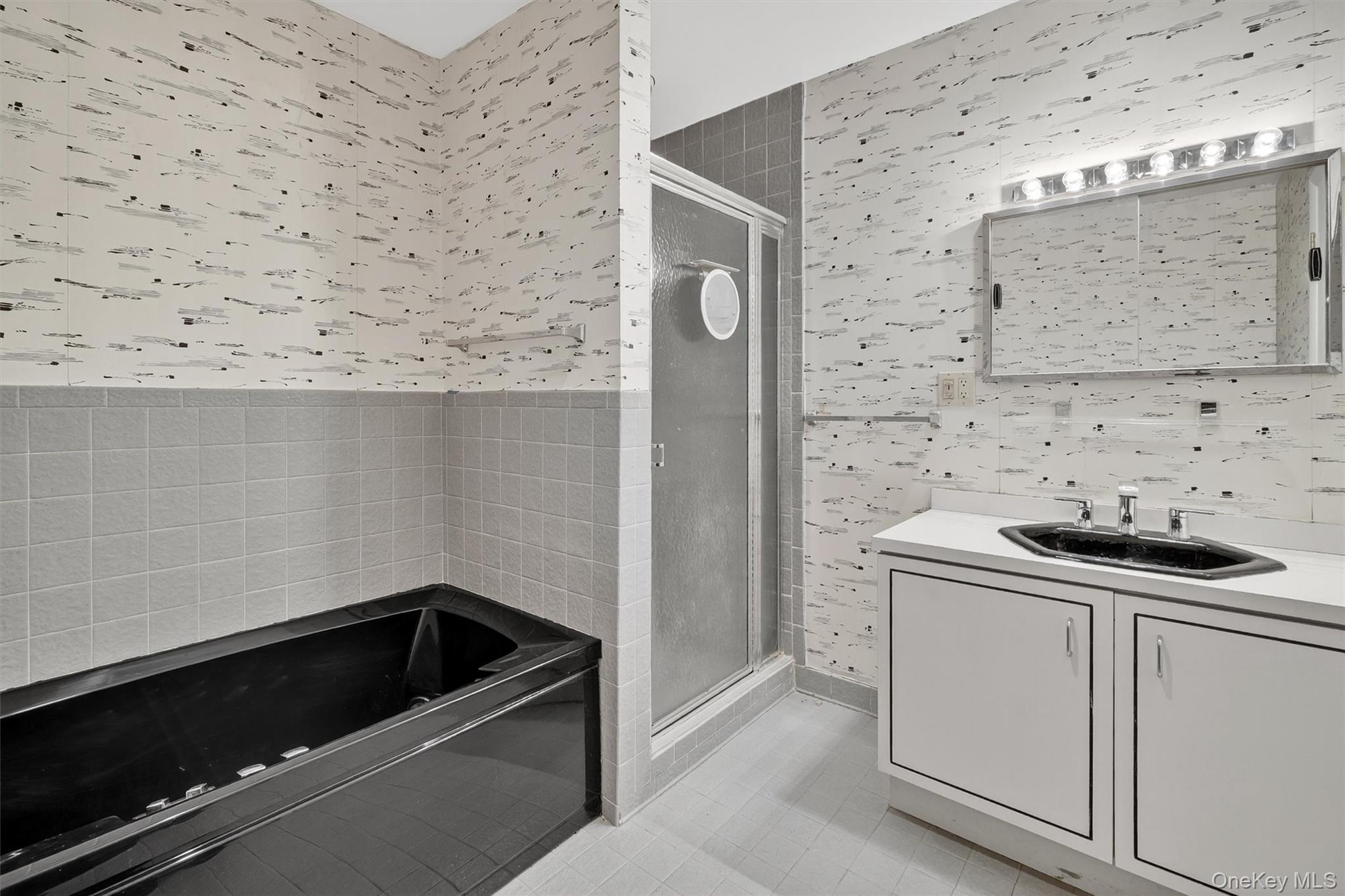 200 California Road, Unit 9 Mount Vernon, NY 10552 - Photo 29 of 50 a bathroom with a sink and a stove with wooden floor