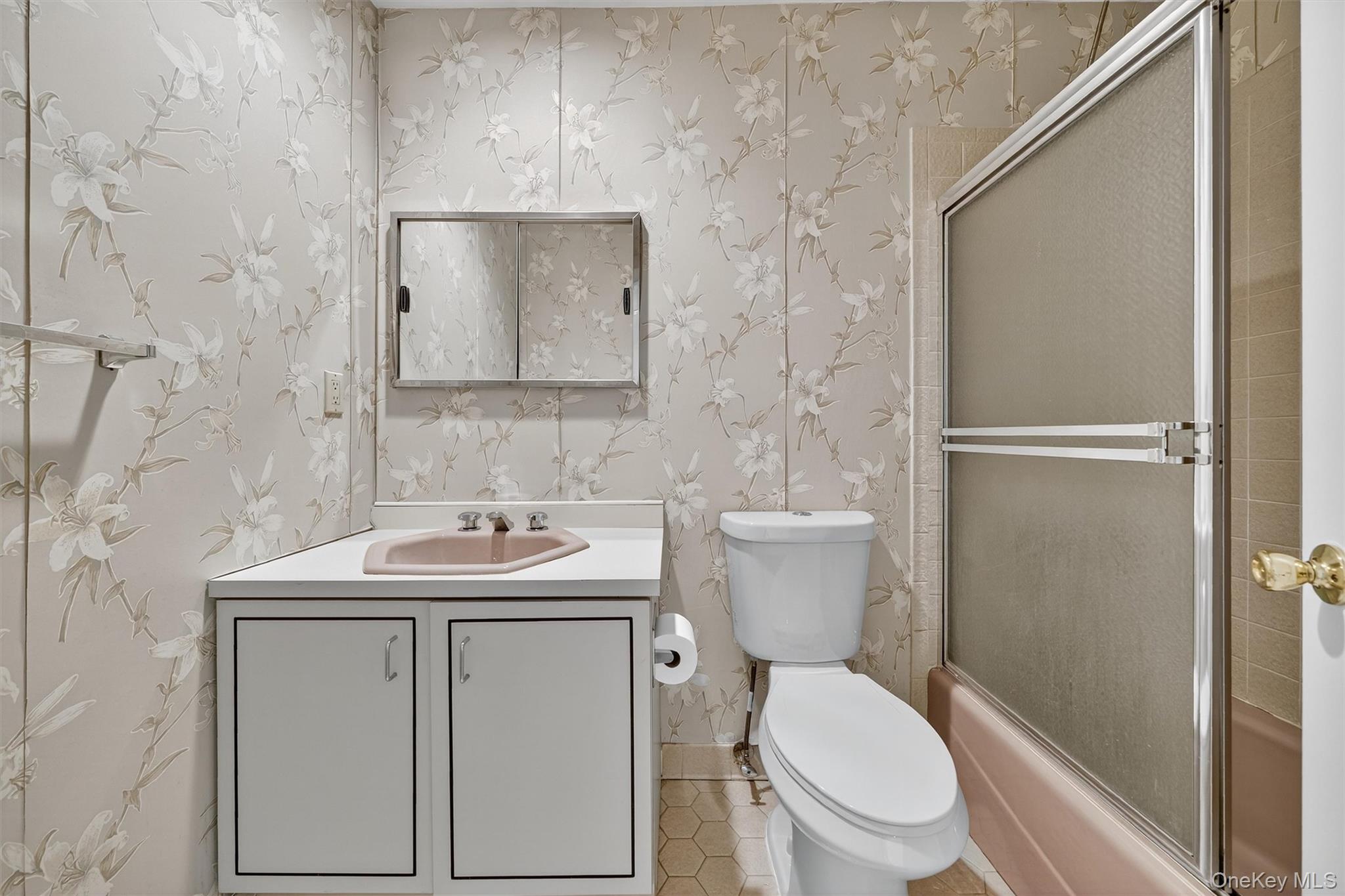 200 California Road, Unit 9 Mount Vernon, NY 10552 - Photo 34 of 50 a bathroom with a toilet sink and mirror