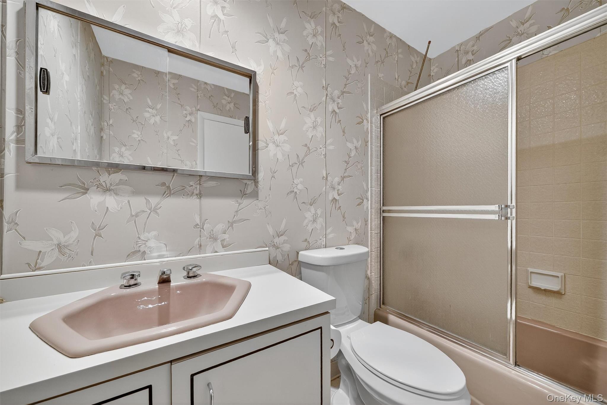 200 California Road, Unit 9 Mount Vernon, NY 10552 - Photo 35 of 50 a bathroom with a sink toilet and mirror