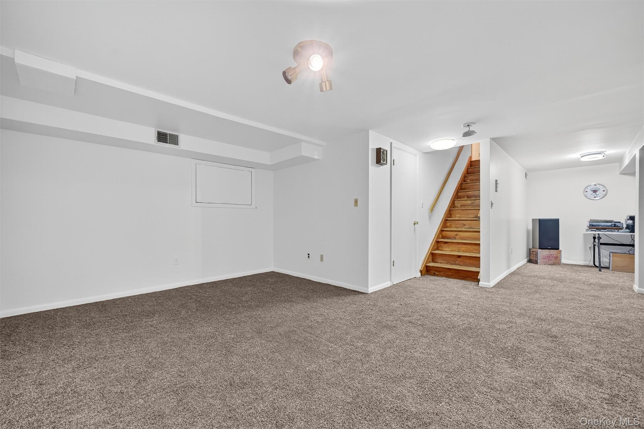 200 California Road, Unit 9 Mount Vernon, NY 10552 - Photo 38 of 50 an empty room with stairs and windows