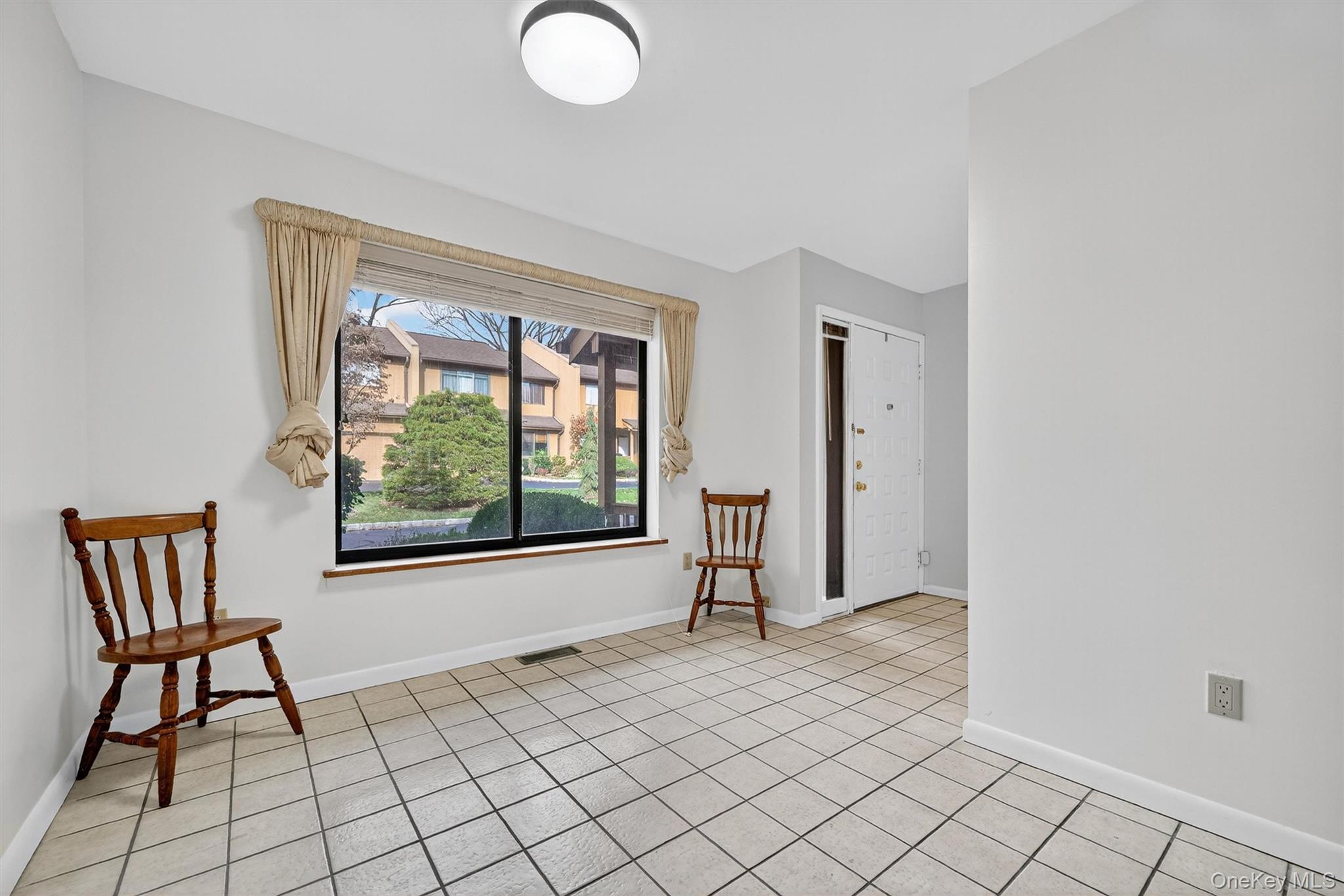 200 California Road, Unit 9 Mount Vernon, NY 10552 - Photo 5 of 50 a view of an empty room and window