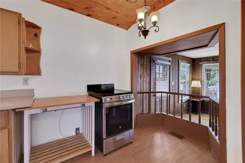 a view of a hallway with entryway and dining room