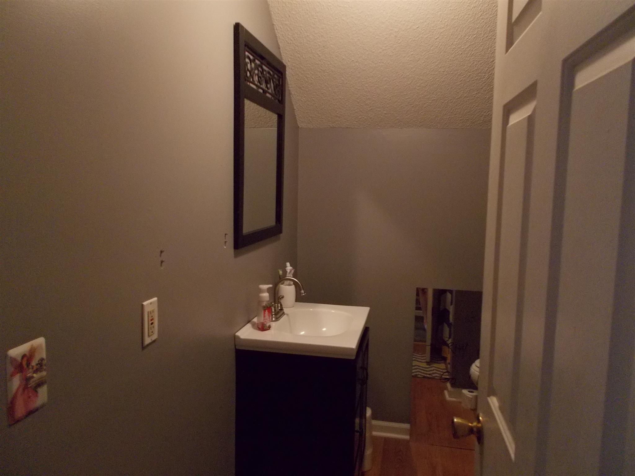 136 Westside Road Lawrenceburg, TN 38464 - Photo 18 of 30 a bathroom with a sink and mirror
