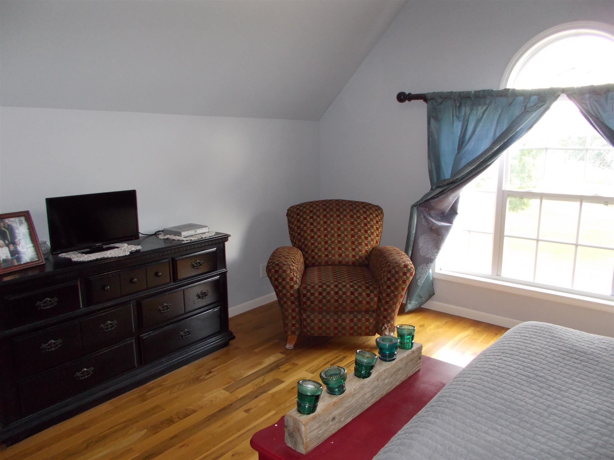 136 Westside Road Lawrenceburg, TN 38464 - Photo 23 of 30 a living room with furniture and a flat screen tv