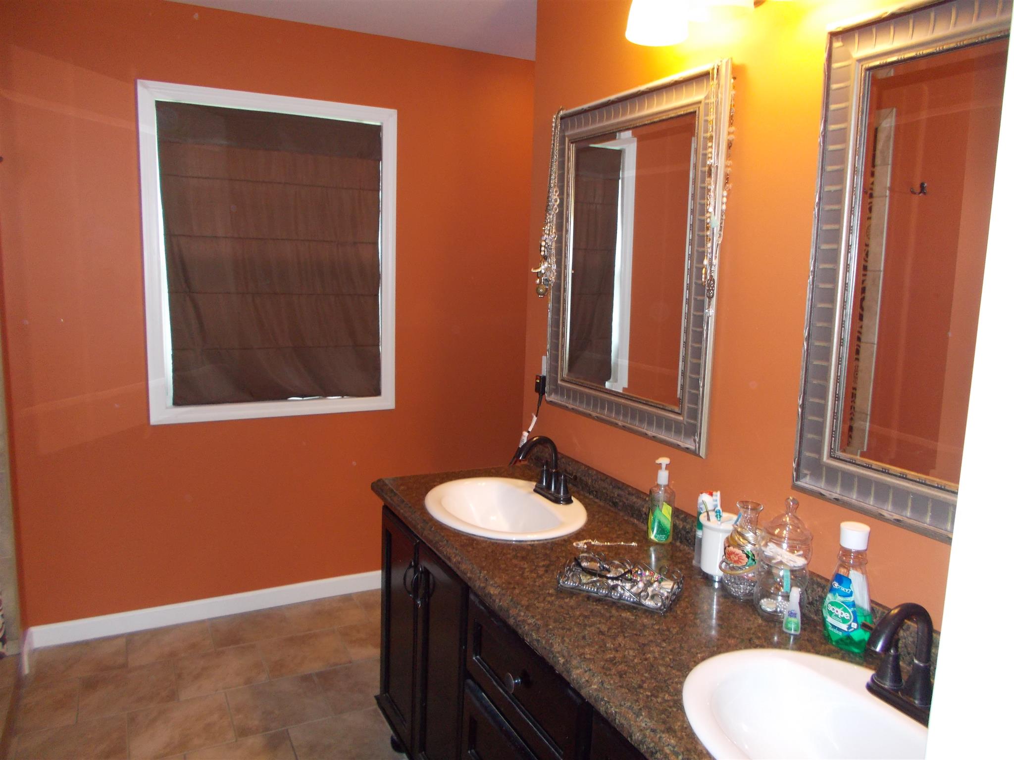 136 Westside Road Lawrenceburg, TN 38464 - Photo 24 of 30 a bathroom with a granite countertop sink and a mirror