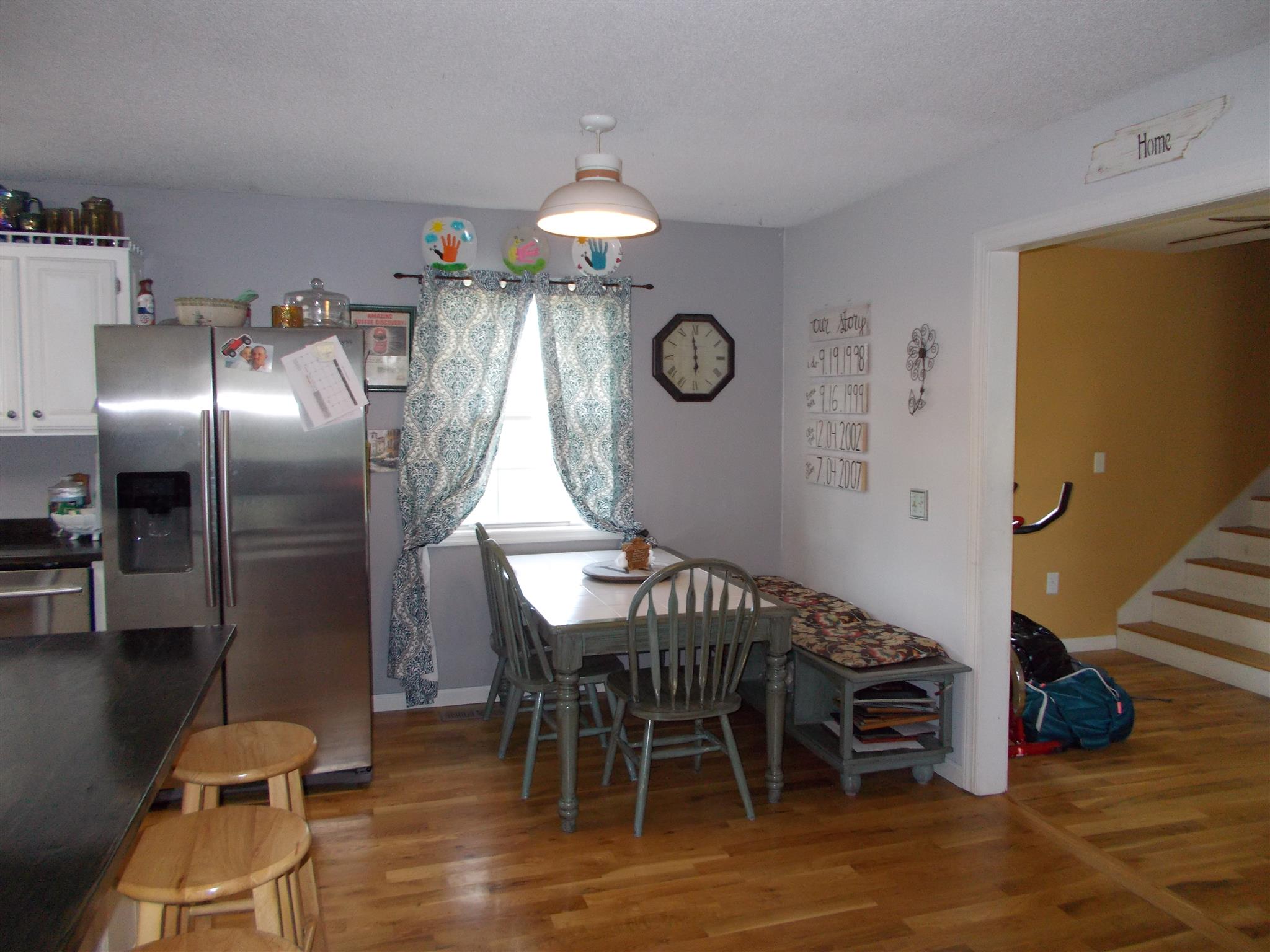 136 Westside Road Lawrenceburg, TN 38464 - Photo 3 of 30 a view of a dining room with furniture and wooden floor