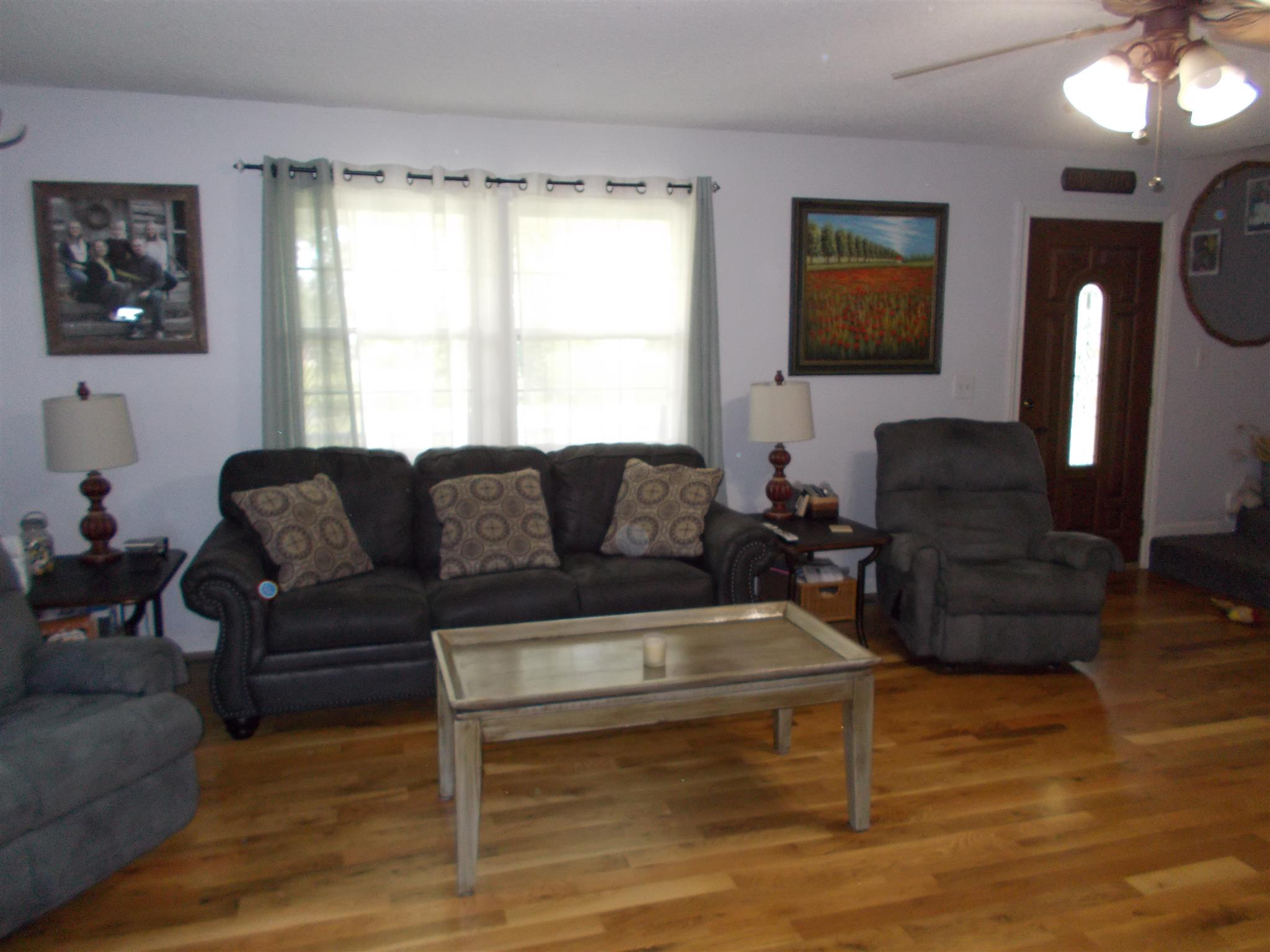 136 Westside Road Lawrenceburg, TN 38464 - Photo 7 of 30 a living room with furniture a flat screen tv and a window