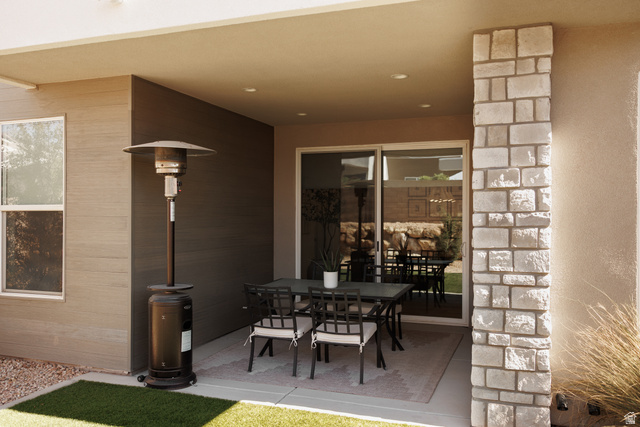 629 Spring Lily Drive St. George, UT 84790 - Photo 40 of 50 Covered patio featuring a concrete slab, recessed lighting, and a stone-clad pillar
