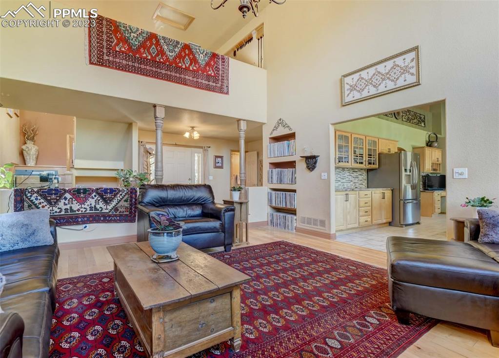 17305 Goshawk Road Colorado Springs, CO 80908 - Photo 19 of 50 a living room with furniture and a rug