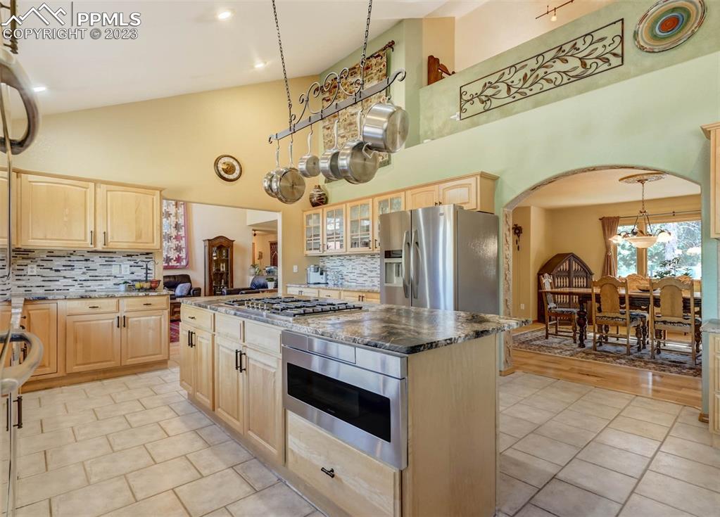 17305 Goshawk Road Colorado Springs, CO 80908 - Photo 21 of 50 a kitchen with stainless steel appliances granite countertop a sink and cabinets