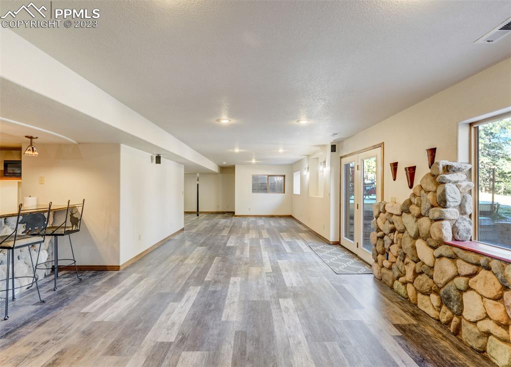 17305 Goshawk Road Colorado Springs, CO 80908 - Photo 40 of 50 a view of a livingroom with furniture and wooden floor