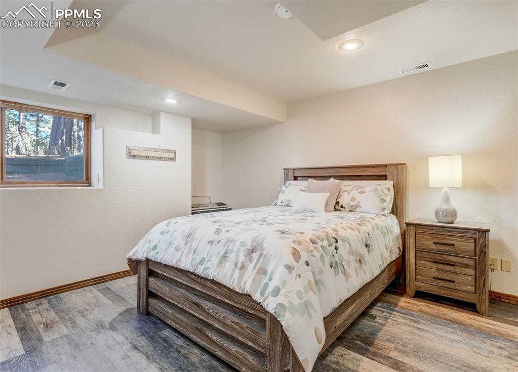 17305 Goshawk Road Colorado Springs, CO 80908 - Photo 43 of 50 a bedroom with a bed and a dresser