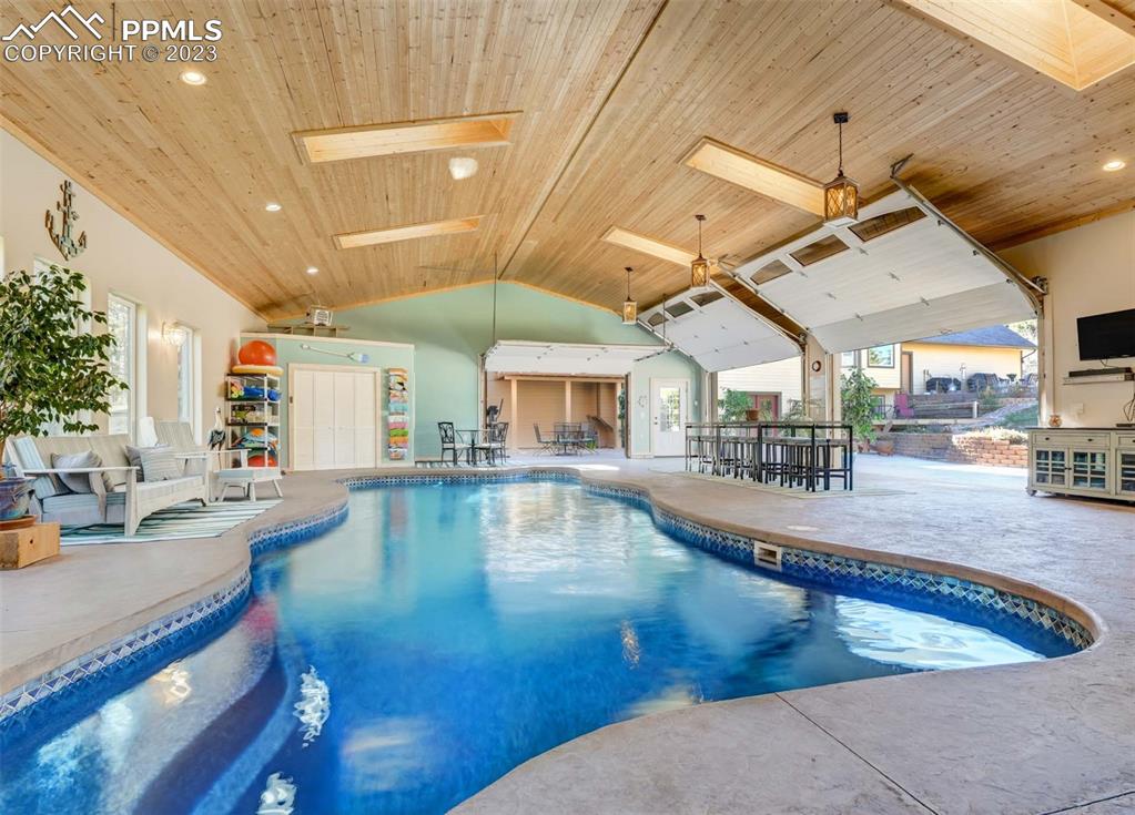 17305 Goshawk Road Colorado Springs, CO 80908 - Photo 9 of 50 a view of a living room and kitchen