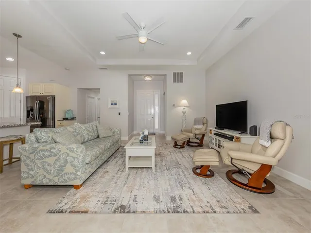 a view of a dining room with furniture wooden floor and chandelier