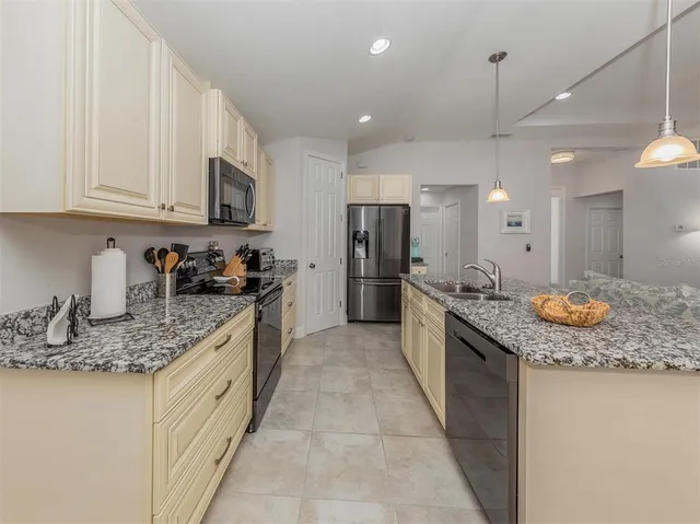 a view of walk in closet with clothes
