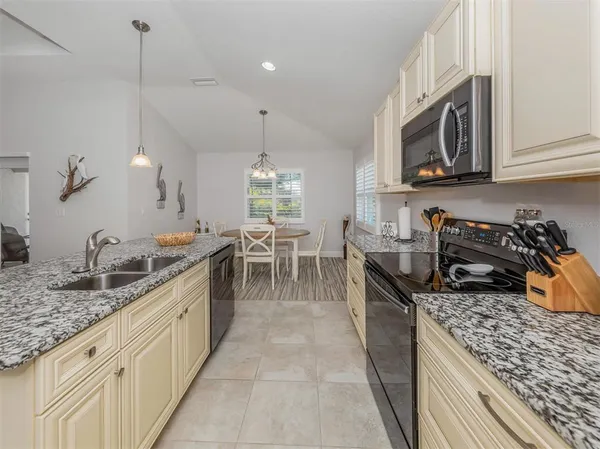 a spacious bathroom with a granite countertop sink mirror and shower