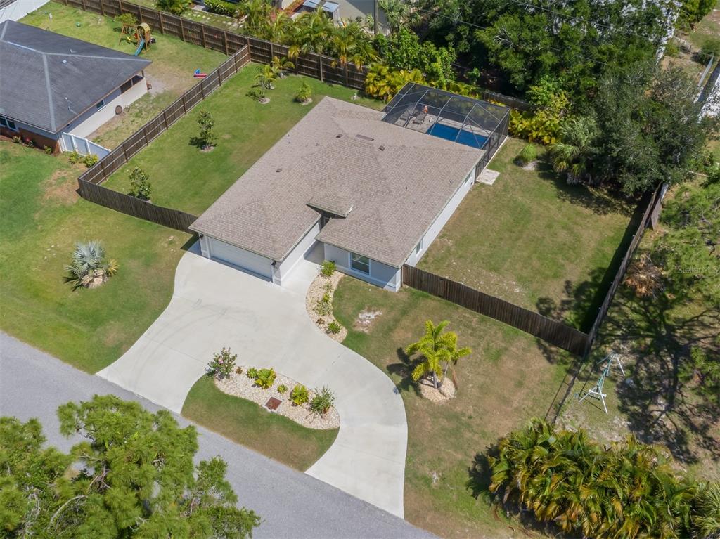 236 Holly Road Venice, FL 34293 - Photo 38 of 88 an aerial view of a house with a yard and garden