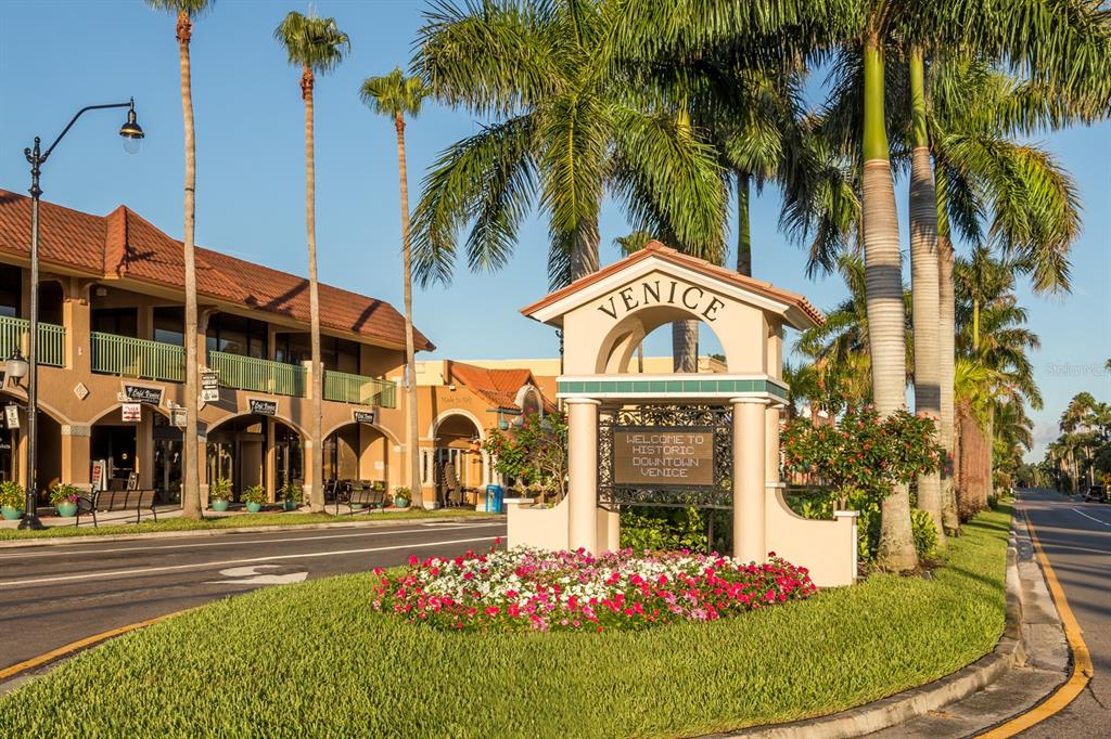236 Holly Road Venice, FL 34293 - Photo 56 of 88 a view of a swimming pool with a garden and plants
