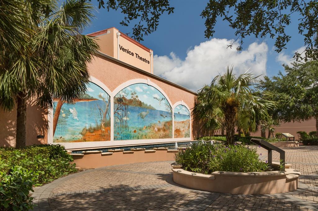 236 Holly Road Venice, FL 34293 - Photo 67 of 88 a view of a swimming pool with a lawn chair and palm trees