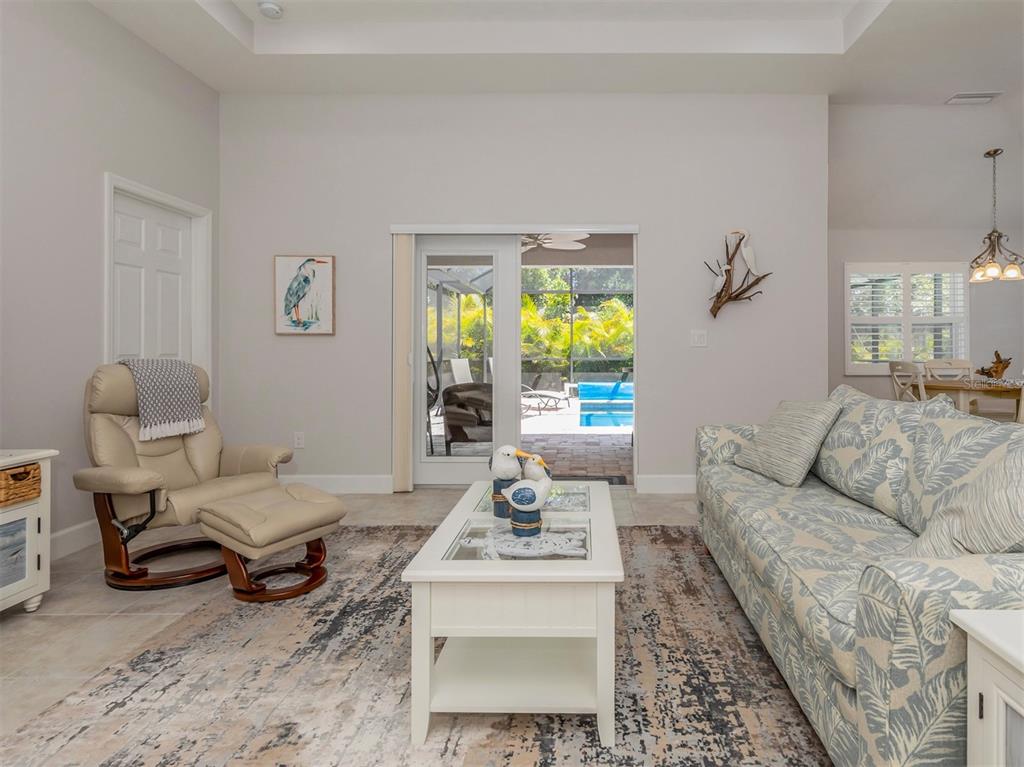 236 Holly Road Venice, FL 34293 - Photo 7 of 88 a living room with furniture and a table
