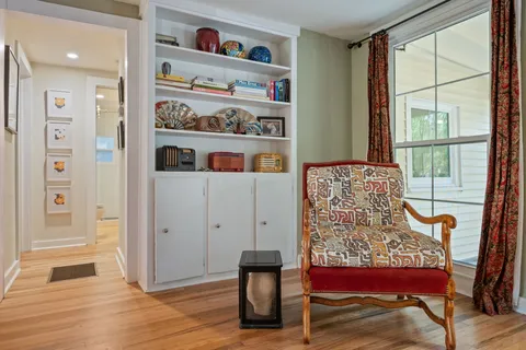 a dining room with furniture and window