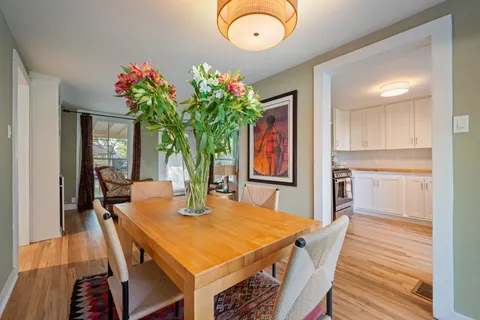 a kitchen with stainless steel appliances granite countertop a sink and a stove top oven