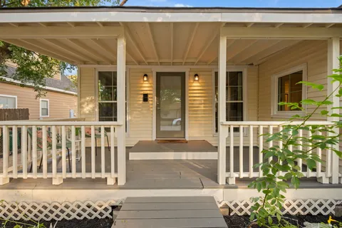 a living room with furniture and next to a window