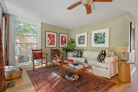 a living room with furniture and a window