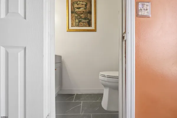 a very nice looking open kitchen with stainless steel appliances granite countertop a stove and a sink