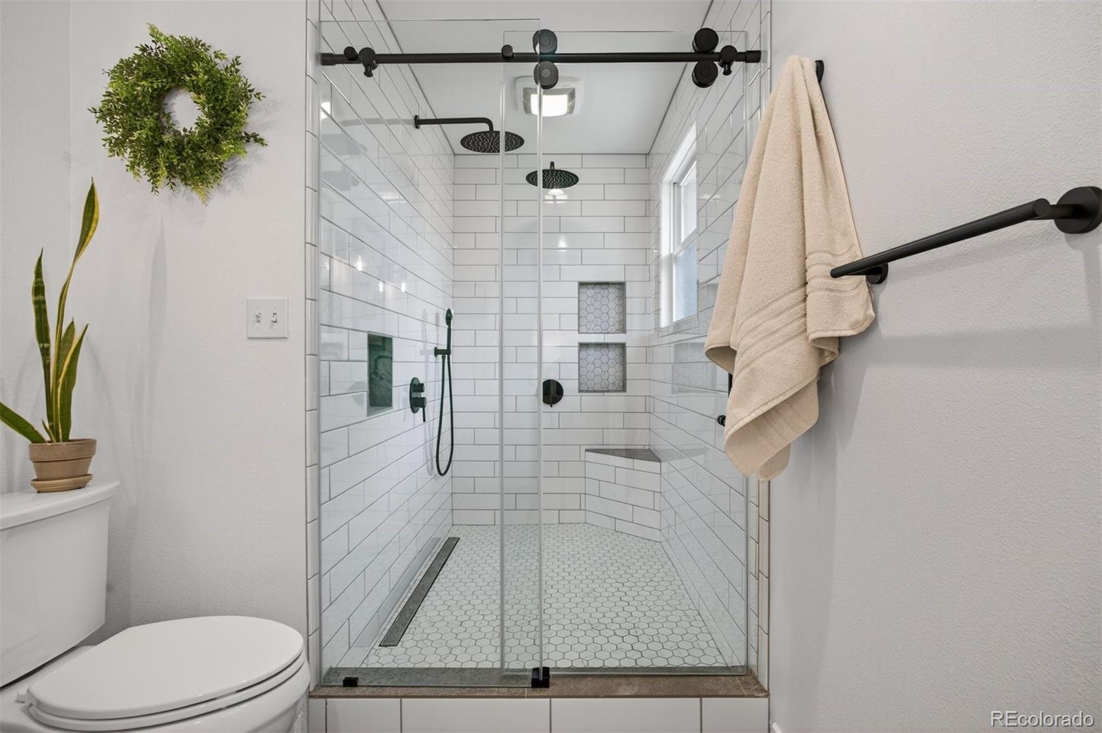 5915 South Birch Way Centennial, CO 80121 - Photo 11 of 22 a bathroom with a toilet and a shower