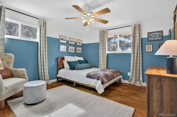 a bedroom with bed and a couch
