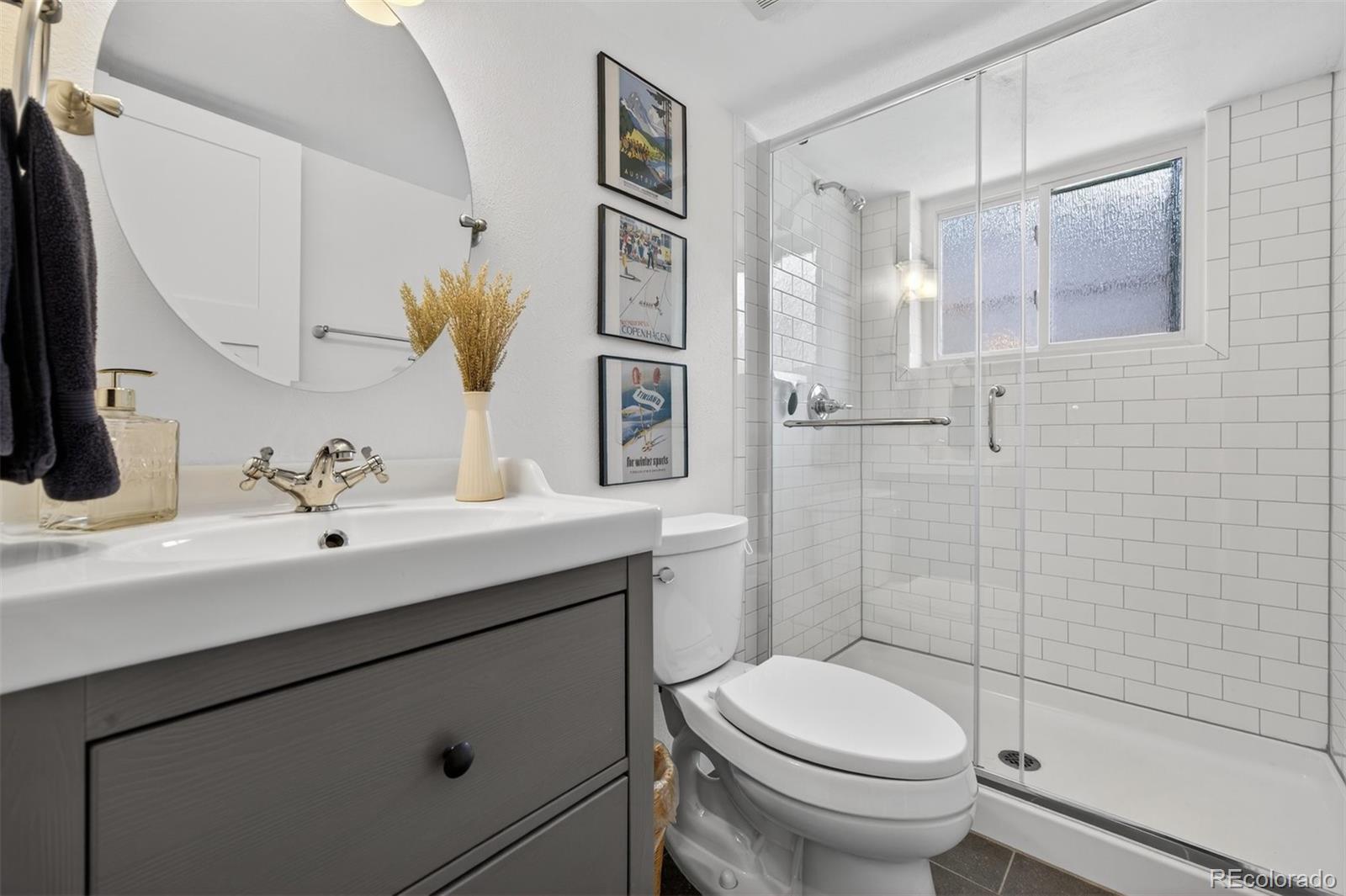 5915 South Birch Way Centennial, CO 80121 - Photo 16 of 22 a bathroom with a sink toilet and shower