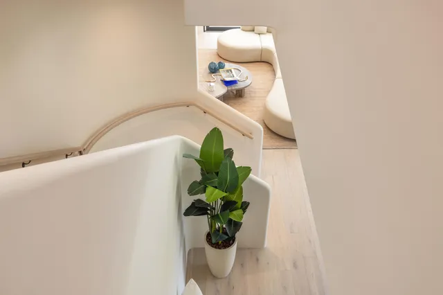 a bedroom with a large bed and a large window