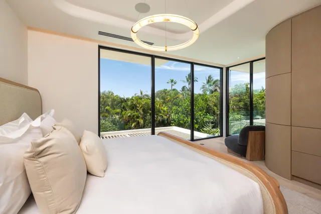 a bathroom with a granite countertop sink mirror and shower