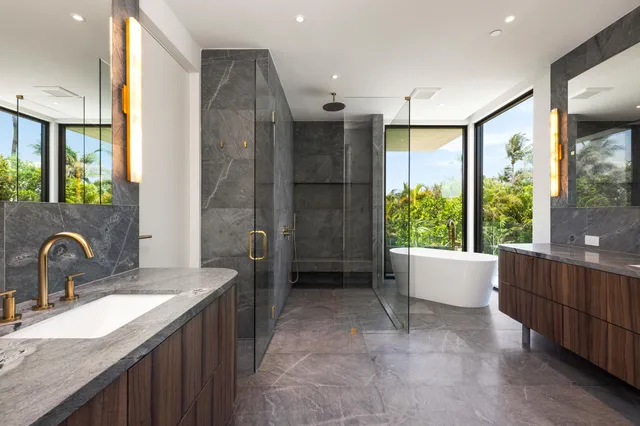 a bathroom with a bathtub and a shower