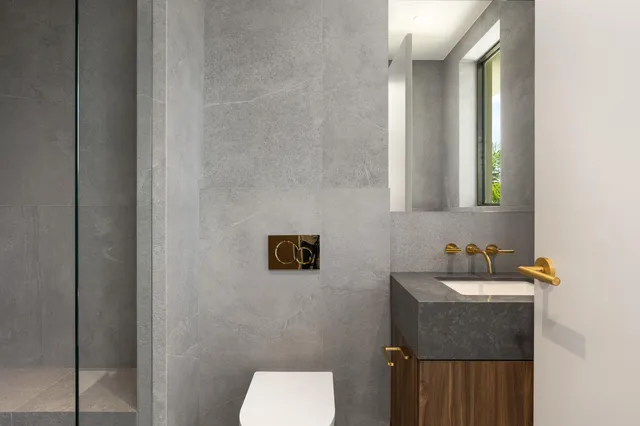 a bedroom with a large bed and a large window