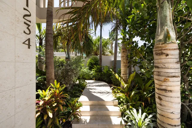 a view of a dining room with furniture wooden floor and chandelier