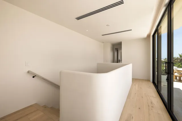 a outdoor dining space with furniture and city view