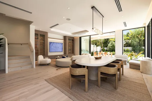 a kitchen with granite countertop kitchen island stainless steel appliances a sink and a center island