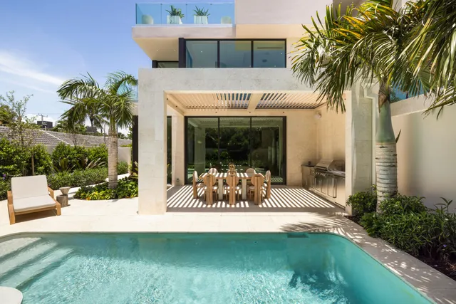 a view of a swimming pool with a patio