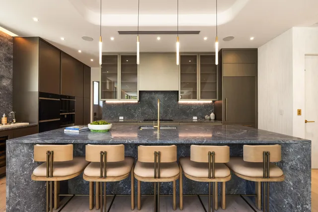 a living room with fireplace furniture and a dining table