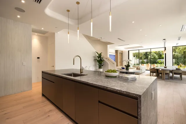 a dining room with furniture window and wooden floor