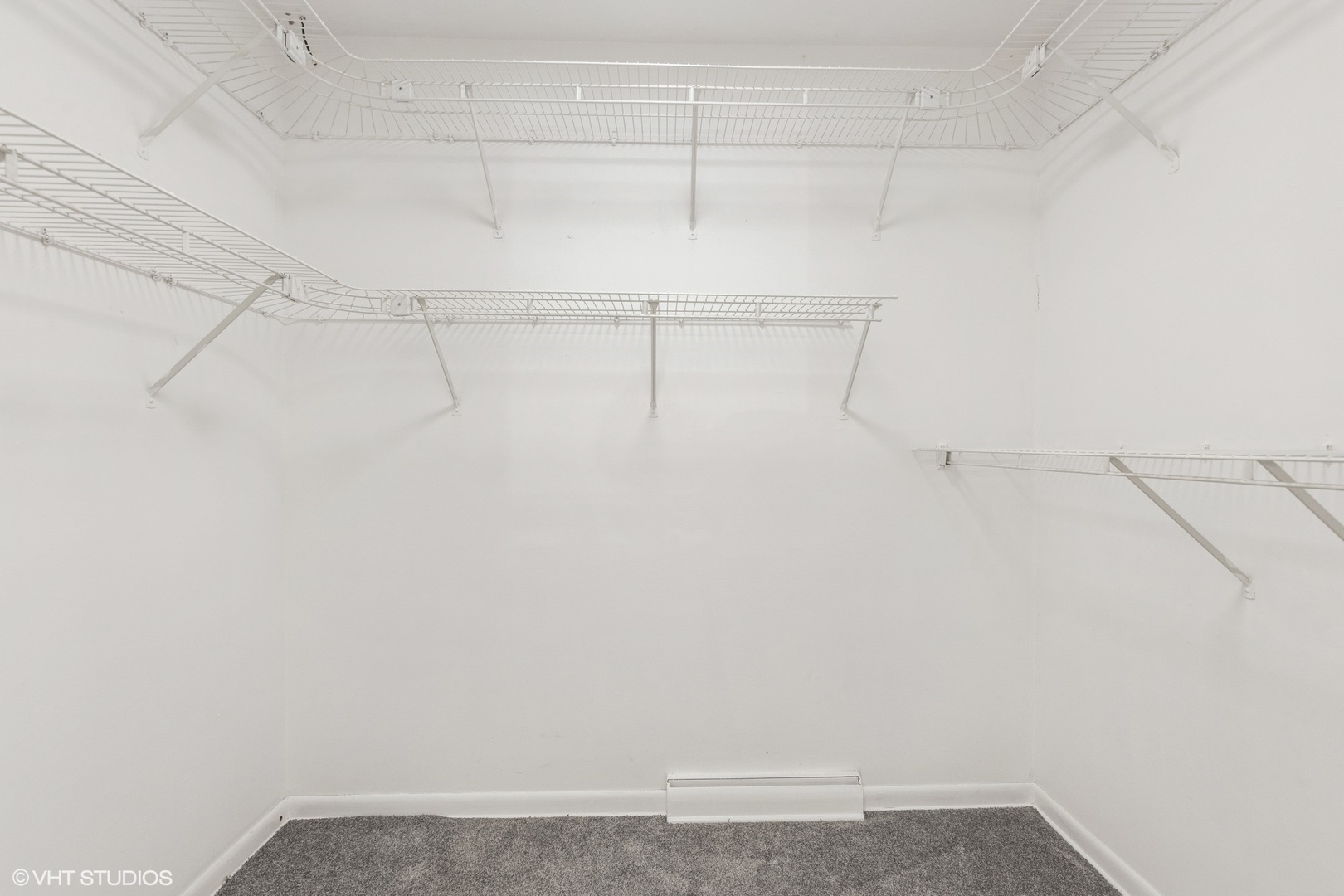 127 Riverside Drive Northfield, IL 60093 - Photo 17 of 27 a view of a room with racks on the wall