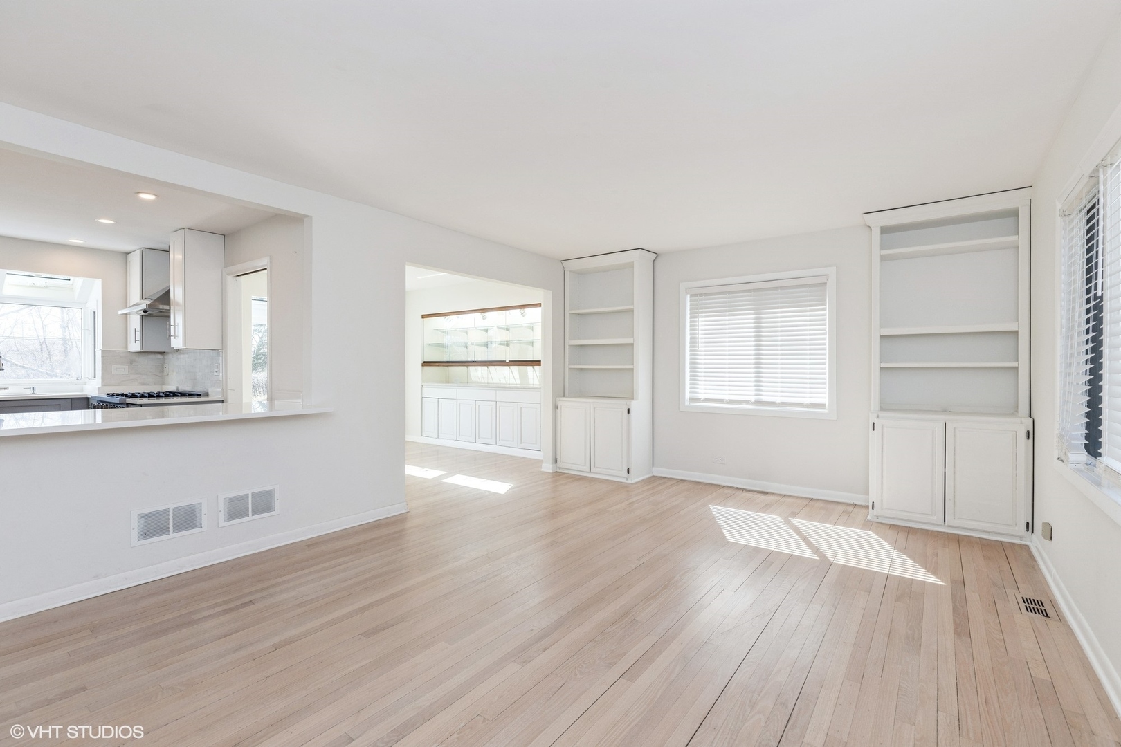 127 Riverside Drive Northfield, IL 60093 - Photo 3 of 27 an empty room with wooden floor and windows